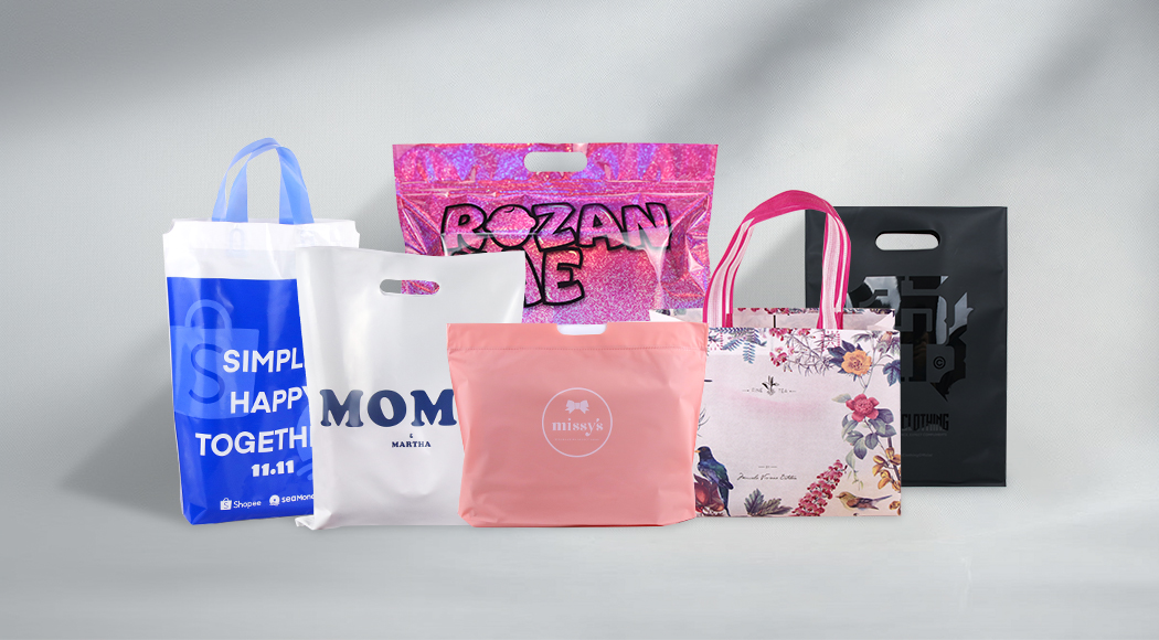 Assortment of customized printed plastic shopping bags with diverse designs for retail use